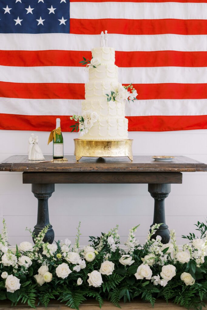 cake table with an american flag in the background at a Lakeview Hills Wedding