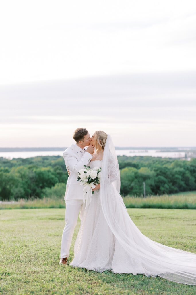 bride and groom kissing at their Lakeview Hills Wedding