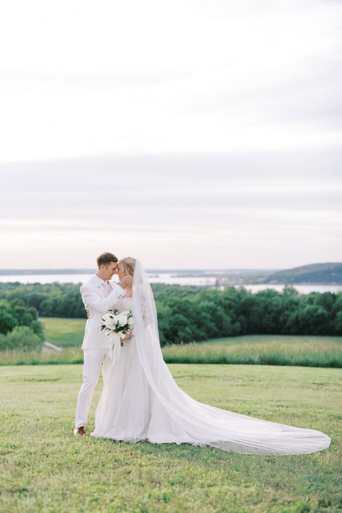 Bride and groom forehead to forehead in wedding attire during their Lakeview Hills Wedding