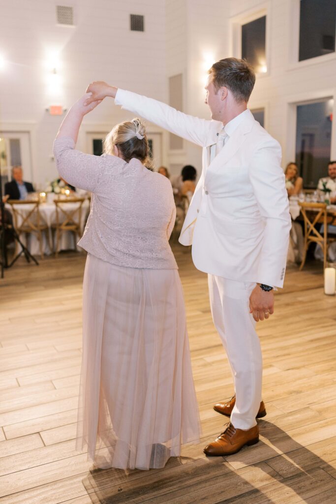 groom twirling his mom at his Lakeview Hills Wedding