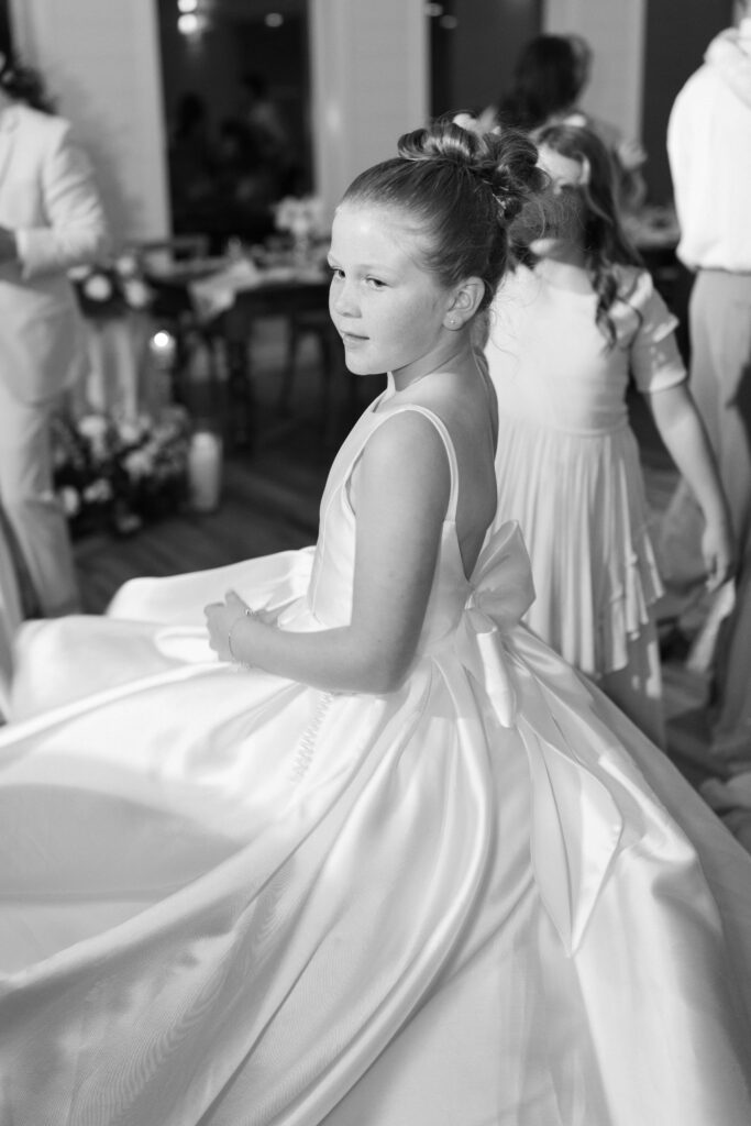 flower girl twirling at this Lakeview Hills Wedding