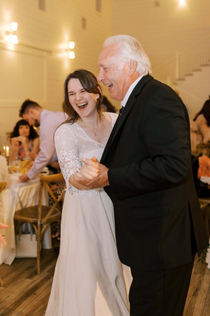guests dancing and laughing at this Lakeview Hills Wedding