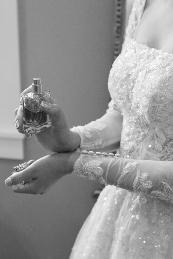 bride outting on her perfume at this Lakeview Hills Wedding