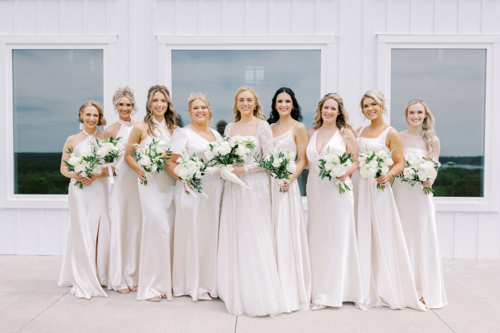 bridesmaids and the bride all lined up at this Lakeview Hills Wedding