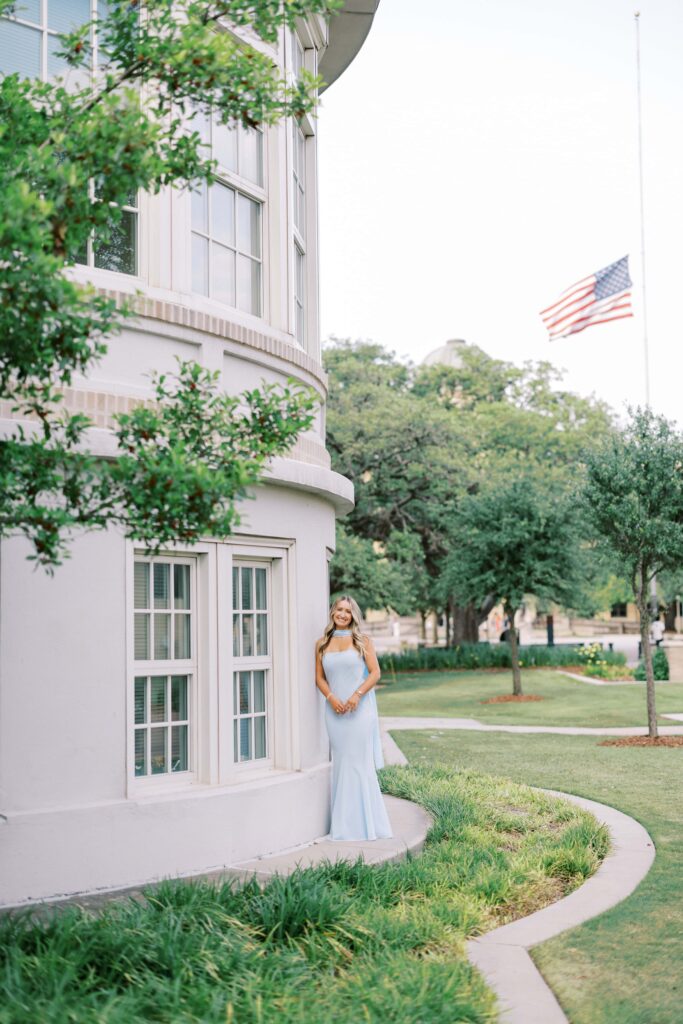 Jodie standing by the ymca building a senior portrait locations