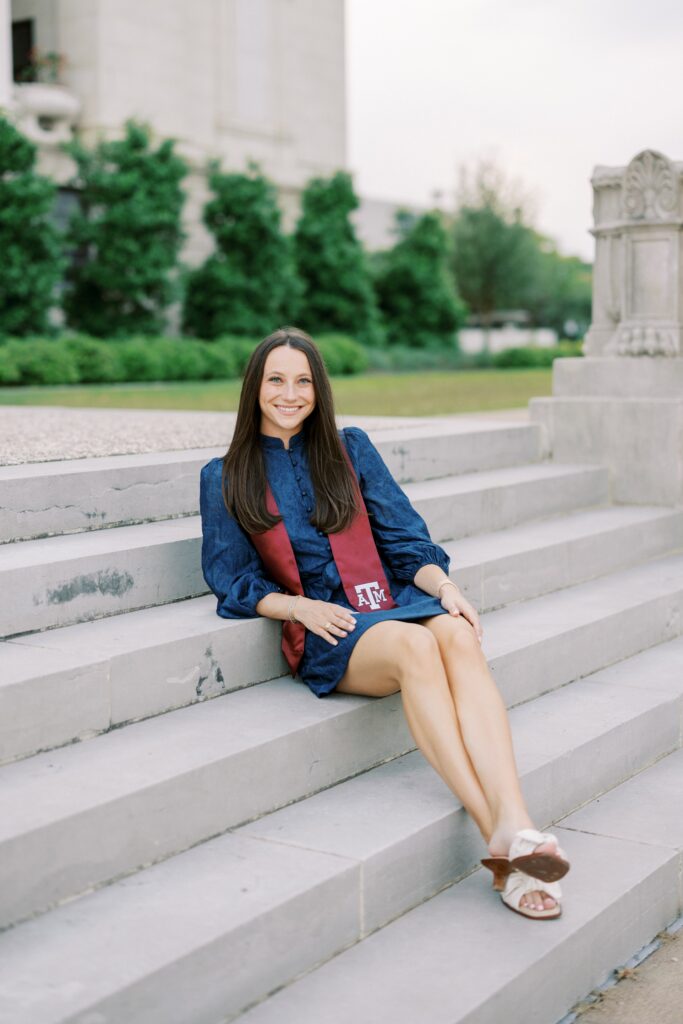 kendall sittng on the stairs in her grad photo outfits