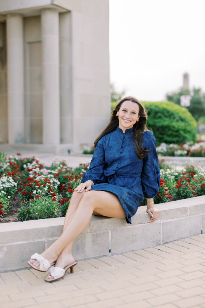 kendall sitting in front of the albritton tower a senior portrait location